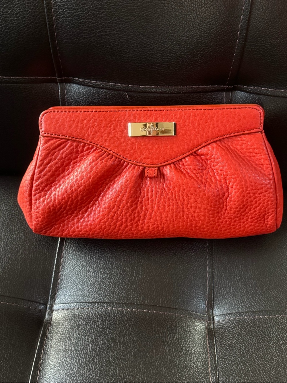 Cole Haan Orange Pebbled Leather Clutch with Gold Plaque